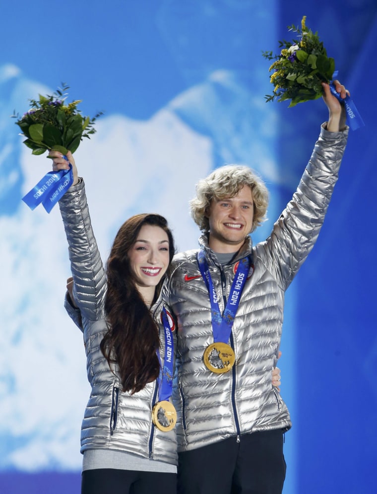 Gold medallists Meryl Davis and Charlie White of the U.S. celebrate during the medal ceremony for the figure skating ice dance free dance program at t...