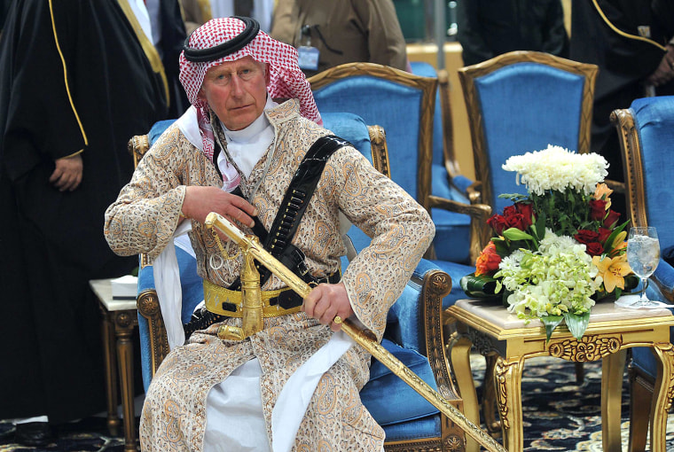 Britain's Prince Charles, wearing a traditional Saudi attire, attends the traditional Saudi dance, known as 'Arda', which was performed during Janadri...