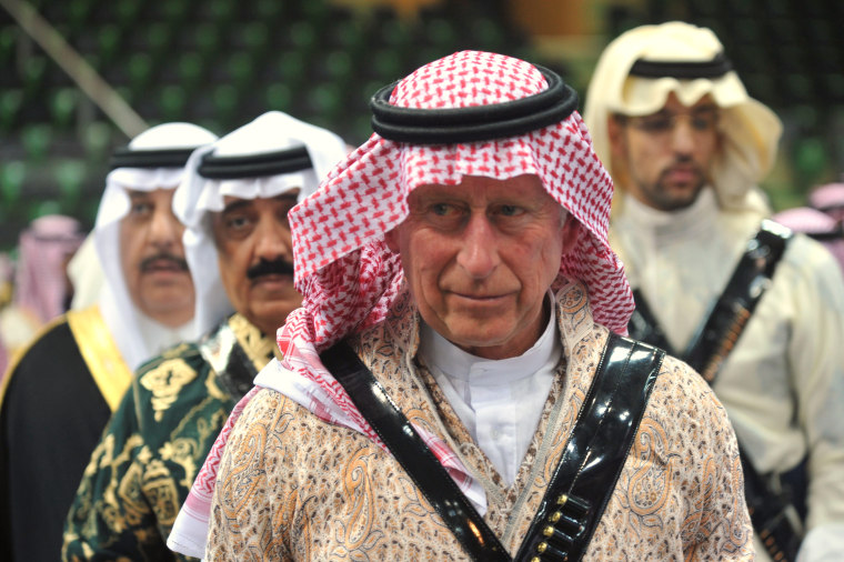 Britain's Prince Charles arrives to participate in the traditional Saudi dancing best known as 'Arda' during the Janadriya culture festival at Der'iya...