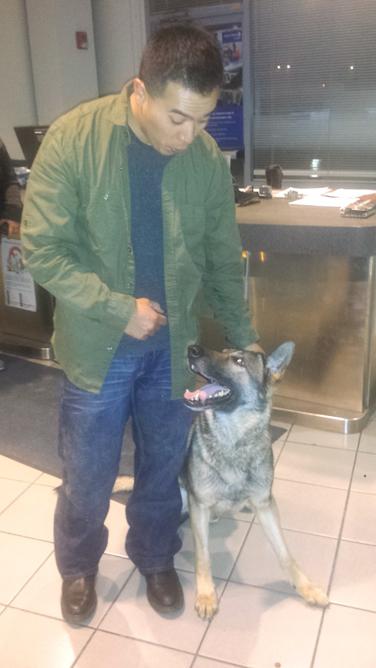 Sgt. Calvin Aguilar reunites Nico the dog.