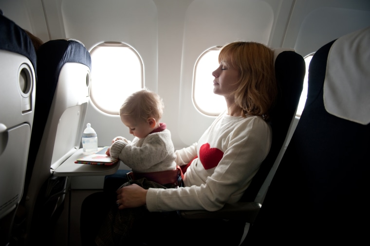 Mother with her baby boy in an aircraft