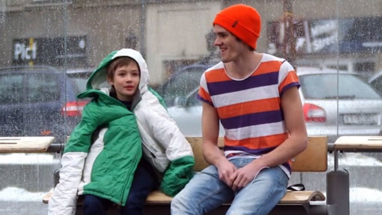 In the video SOS Mayday, strangers give up their jackets to a shivering kid on a freezing, wet day in Norway.