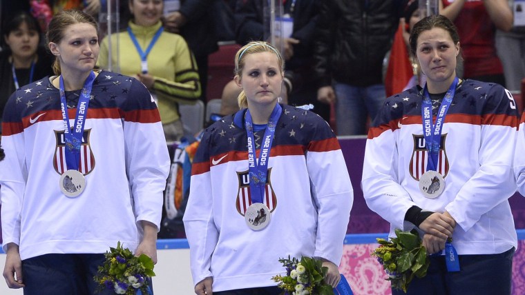 US players cry during the Women's Ice Hockey Medal Ceremony at the Bolshoy Ice Dome plaza during the Sochi Winter Olympics on February 20, 2014.    AF...