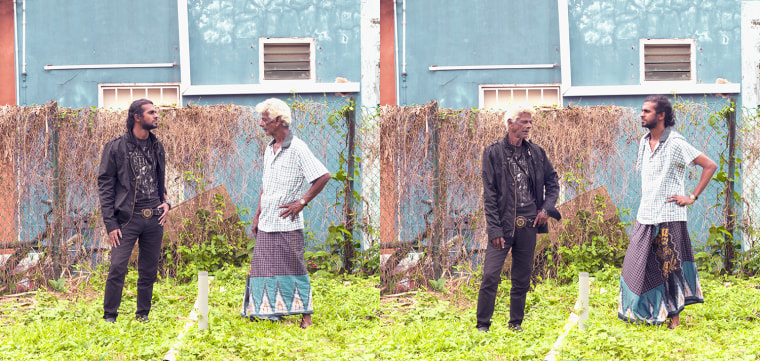 The photographer said the kids were more easily coaxed into swapping clothes – but this elder looks plenty comfortable in his new duds.