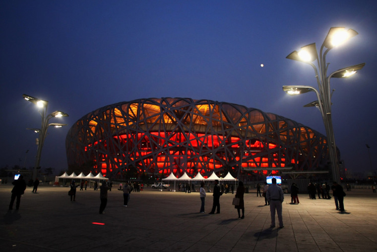 BEIJING - DECEMBER 10:  Crowds of tourists visit the National Stadium, known as the \"Bird's Nest\",on December 10, 2008 in Beijing, China. The Bird's N...