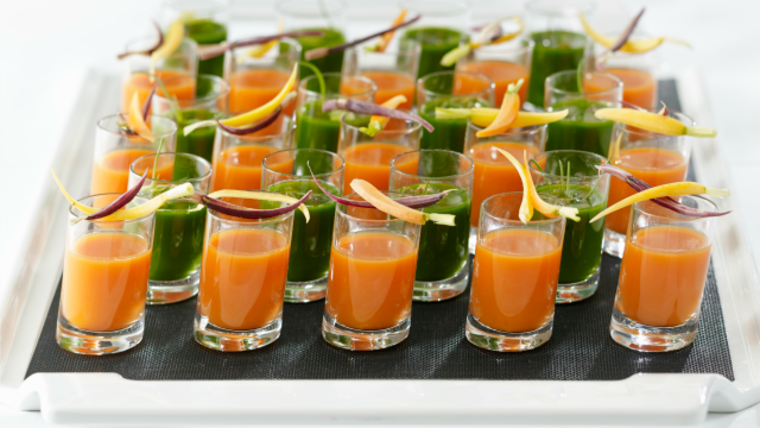Chef Wolfgang Puck's Power Smoothie Shots (the green liquid pictured above) can be made in a blender or juicer and are a refreshing way to kick off your party.