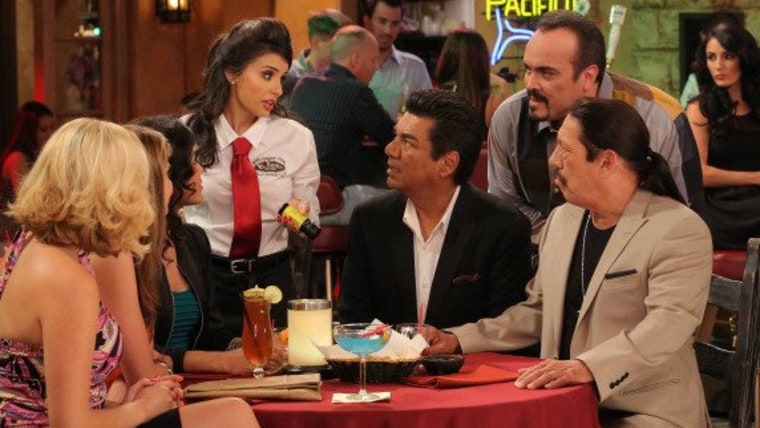 A scene from the first episode of \"Saint George\" starring (from center, L-R): Mikaela Hoover as Chloe, George Lopez as George, David Zayas as Junior, ...