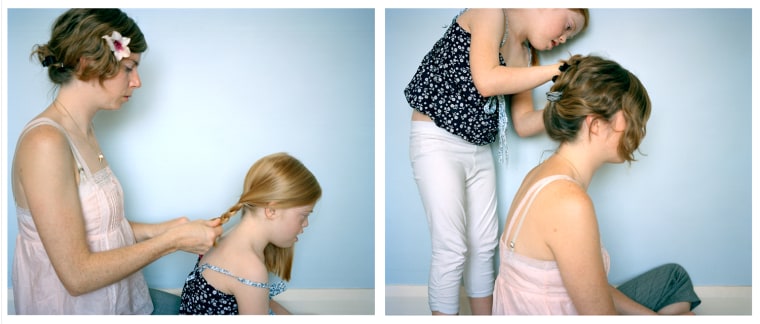 The mother-daughter photo project captures simple moments, like the pair doing each other's hair (here in 2011).