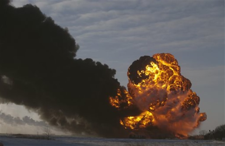 A fireball goes up at the site of an oil train derailment Monday, Dec. 30, 2013, in Casselton, N.D. Several explosions were reported as some cars on the mile-long train caught fire.