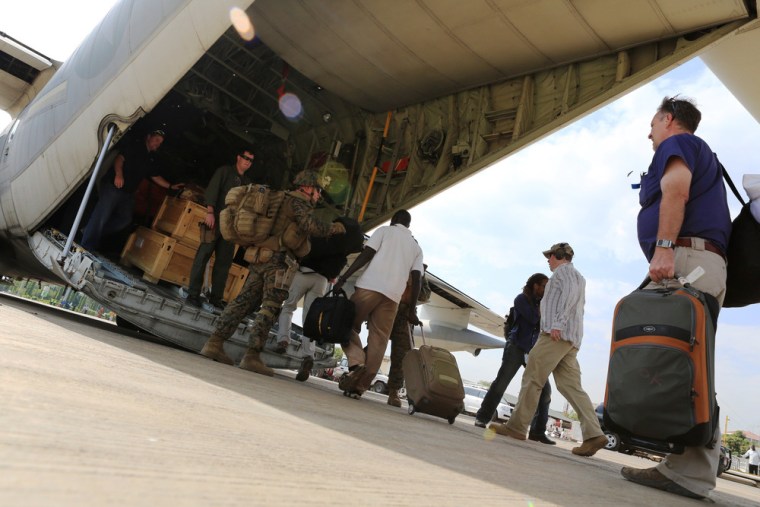 This picture provided by the US Marines shows Marines and sailors with Special-Purpose Marine Air-Ground Task Force Crisis Response evacuate personnel from the US Embassy in Juba, South Sudan, on Friday.