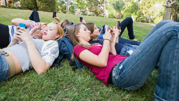 teen, teens, text, hang out, grass, outside, chidlren, school, kids, texting