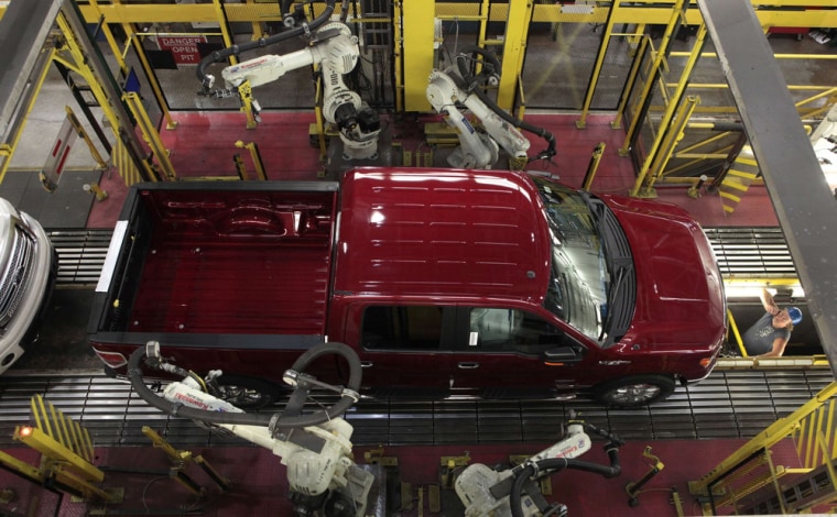 Robots do a quality control check of a 2014 Ford F-150 pick-up truck as it moves down the assembly line at the Ford Motor Dearborn Truck Plant in Michigan. A resurgence in truck purchases helped boost 2013 auto sales to their best finish in six years.
