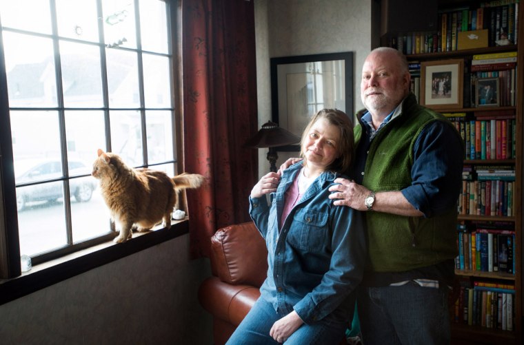 VeraMae Volk and her husband Eric Vaughn pose for a portrait at their home in Lynn, Mass., Tuesday, Dec. 31, 2013.