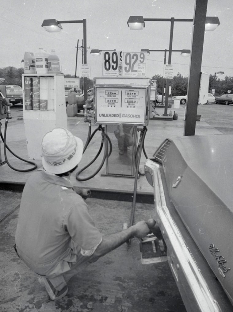 Attendant Joe Turchiano pumps gasoline in Shirley, on New York's Long Island, on May 14, 1979, as an alcohol-unleaded gasoline mixture goes on sale for the first time.