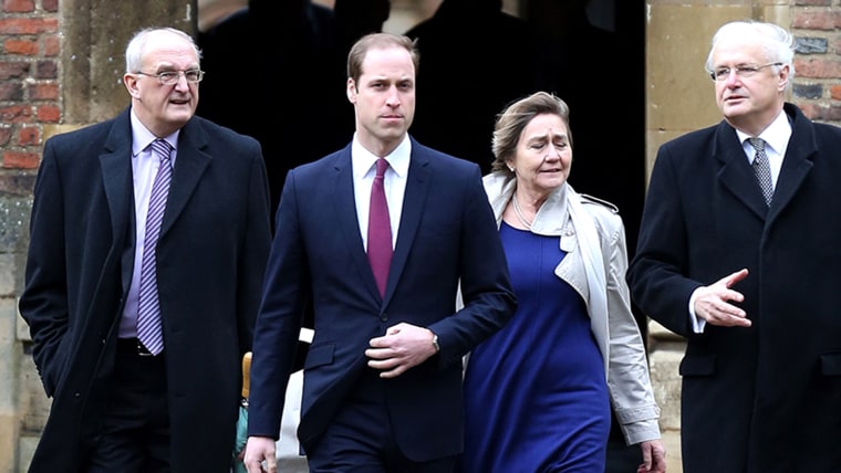 Britain's Prince William, Duke of Cambridge, (2L) arrives at  St John's College, Cambridge, alongside Leszek Borysiewicz (L) Vice Chancellor Universit...
