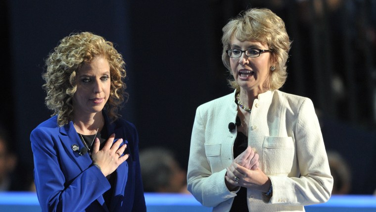 Chair of the Democratic National Committee Debbie Wasserman Schultz (L) and former congresswoman Gabrielle Giffords deliver the Pledge of Allegiance a...