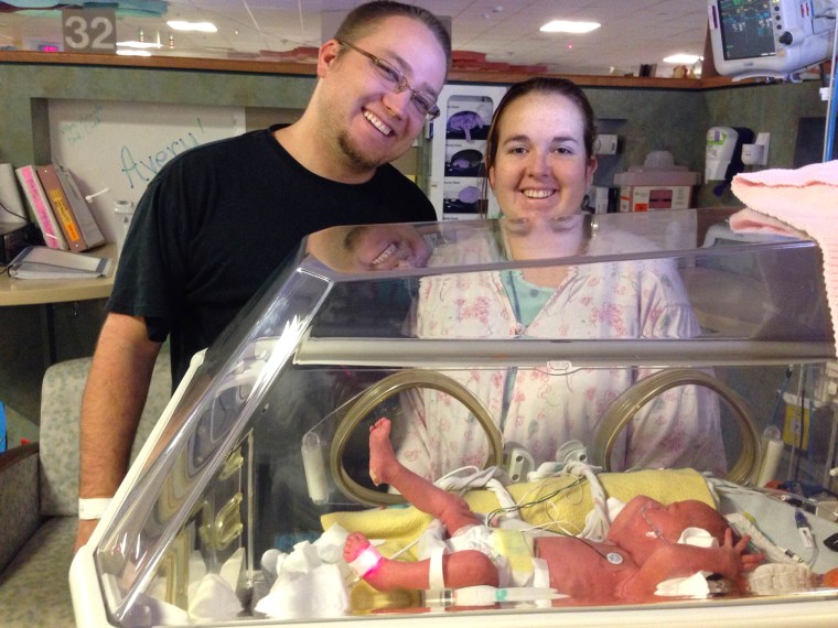 \"We're very blessed,\" says Chad Doss, pictured here with wife Amanda and one of their identical triplet girls, born Dec. 30.