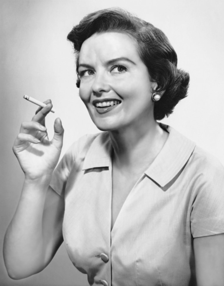 UNITED STATES - CIRCA 1950s: Portrait of woman holding cigarettte. (Photo by George Marks/Retrofile/Getty Images)