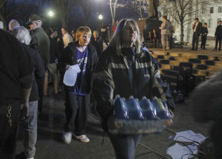 Residents pick up drinking water at the state capitol in Charleston, West Virginia, on Friday.