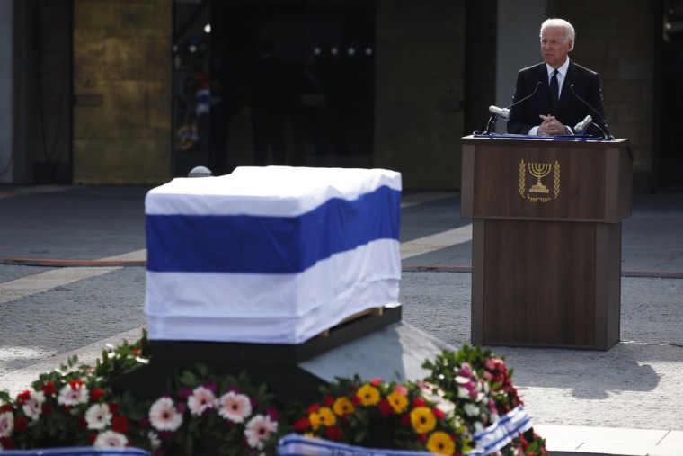 Vice President Joe Biden speaks near Ariel Sharon's flag-draped coffin on Monday.