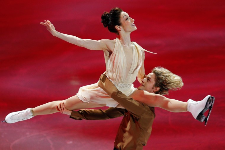 Ice dance gold medallists Meryl Davis and Charlie White (R) skate during an exhibition event at the conclusion of the U.S. Figure Skating Championship...