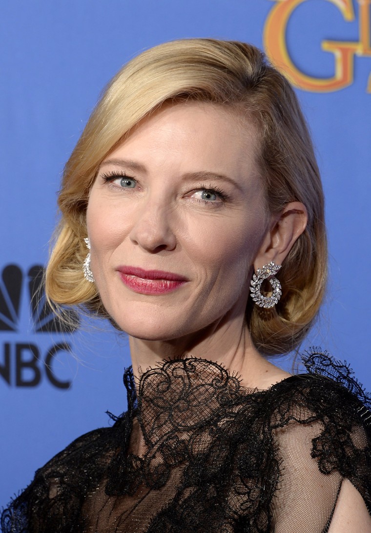 BEVERLY HILLS, CA - JANUARY 12:  71st ANNUAL GOLDEN GLOBE AWARDS -- Pictured: Actress Cate Blanchett poses with her award for Best Performance by an A...