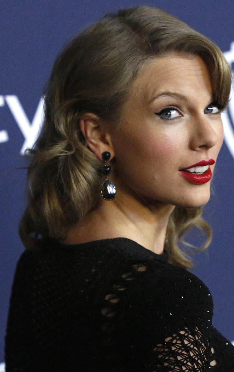 Singer Taylor Swift poses at the 15th annual Warner Bros. and InStyle after party, after the 71st annual Golden Globe Awards in Beverly Hills, Califor...