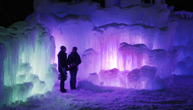 Visitors tour an ice castle at the base of the Loon Mountain ski resort on Jan. 8 in Lincoln, N.H.