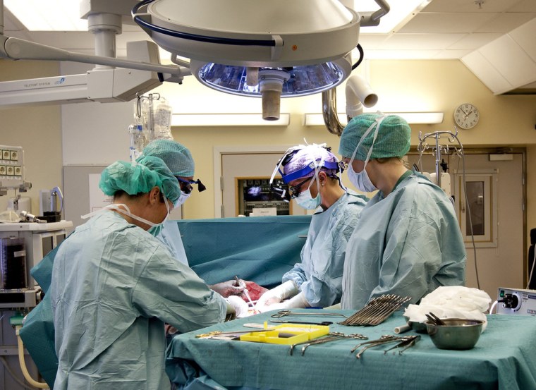 In this April 4, 2012, photo made available by the University of Goteborg in Sweden, the Swedish research team practices before the operations to transplant wombs at the Sahlgrenska Hospital in Goteborg, Sweden. Nine women in Sweden have successfully received transplanted wombs donated from relatives and will soon try to become pregnant.