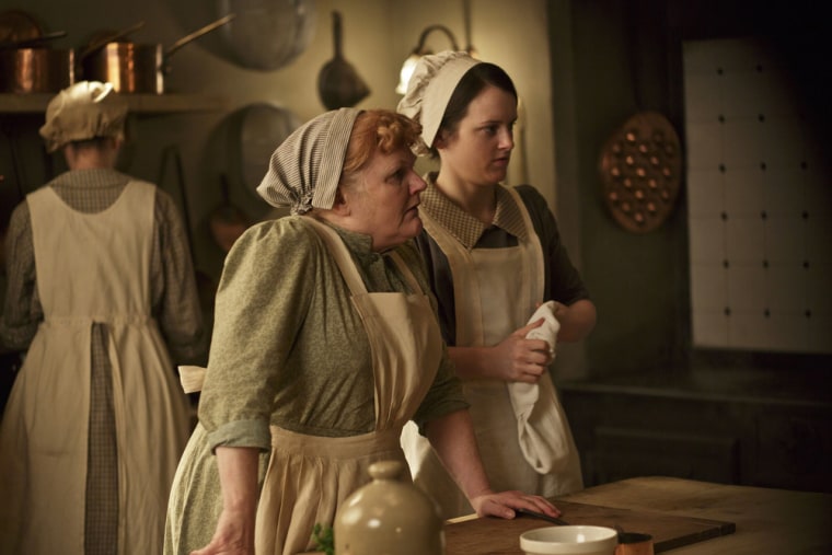 This photo released by PBS and Carnival Film and Television Limited shows, from left, Lesley Nicol as Mrs. Patmore, and Sophie McShera as Daisy, in a ...