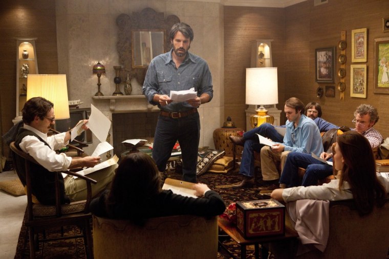 This film image released by Warner Bros. Pictures shows Ben Affleck as Tony Mendez, center, in \"Argo,\"  a rescue thriller about the 1979 Iranian hosta...