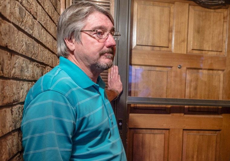 John Masterson and his wife Lea stand outside their door as they talk to the media Tuesday night. Masterson confronted the shooter at a Roswell, N.M., middle school. school Tuesday morning.