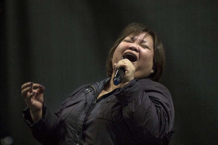 Rose Fostanes, 47, a Filipina caregiver, rehearses for Israel's X-Factor show in Tel Aviv, on Jan. 12.