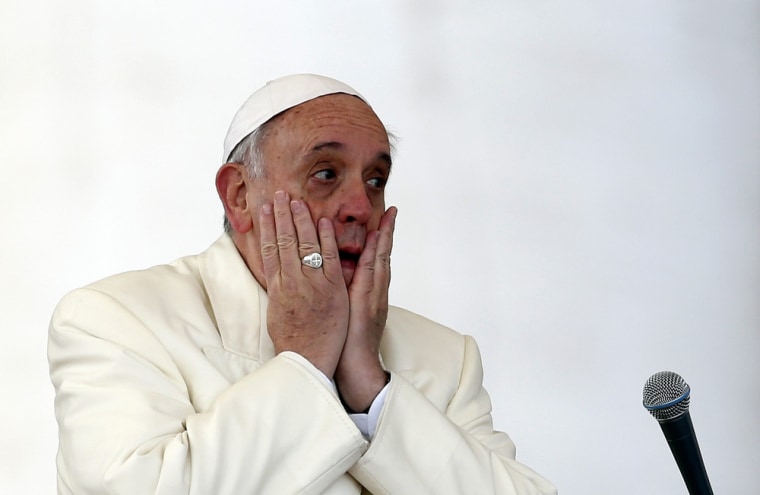 Pope Francis reacts as he leads a Wednesday general audience in Saint Peter's square at the Vatican January 15, 2014. REUTERS/Alessandro Bianchi (VA...
