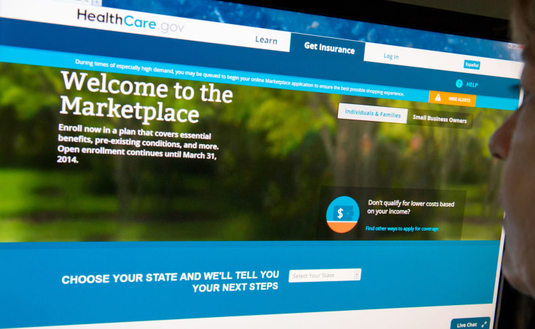 (FILES)This December 2, 2013 file photo shows a woman reading the HealthCare.gov insurance marketplace internet site in Washington, DC. President Bar...