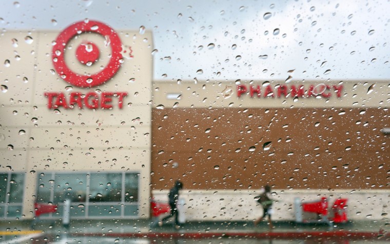 (FILES) A couple of shoppers leave a Target store on a rainy afternoon in Alhambra, California in this December19, 2013, file photo. Target said on Ja...
