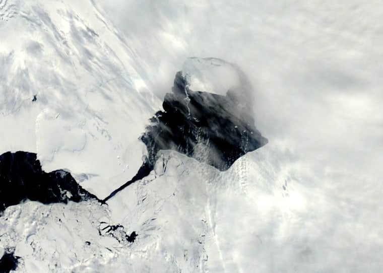A NASA satellite image snapped Nov. 13, 2013, shows open water between Pine Island Glacier and its massive iceberg.