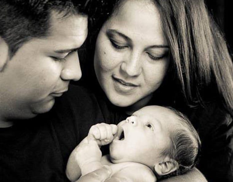 Erick and Marlise Munoz hold their son, Mateo.