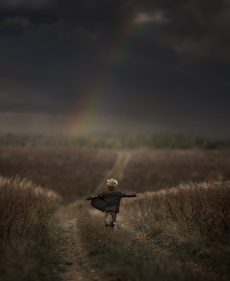 Shumilova photographs her 5-year-old son running down a hill in Russia.