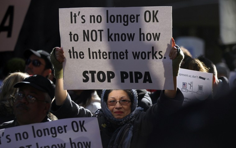 NEW YORK, NY - JANUARY 18: Protesters demonstrate against the proposed Stop Online Piracy Act (SOPA) and Protect IP Act (PIPA) outside the offices of...