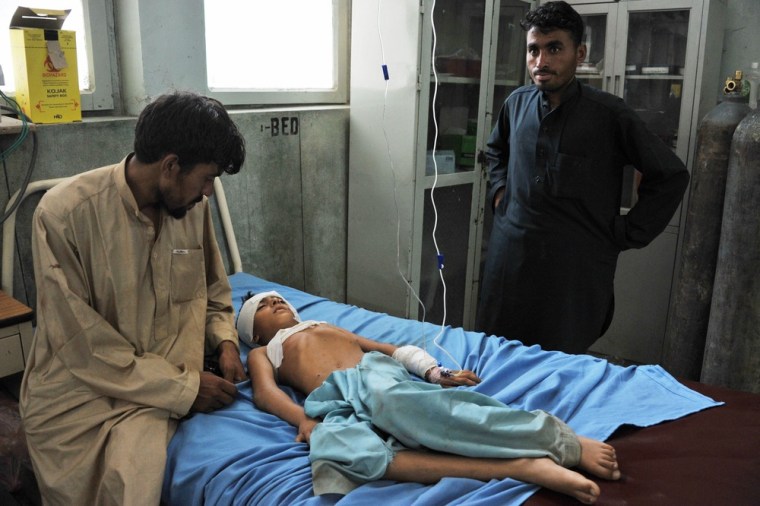 A wounded boy receives treatment at a hospital in Jalalabad after an explosion in a graveyard in Nangarhar province on Thursday.