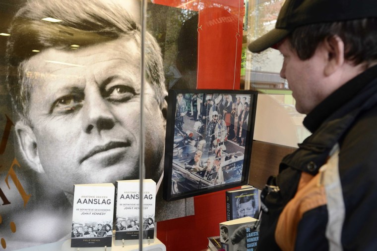 Books about the anniversary of the assassination of US president John F. Kennedy are on display in a store window in The Hague, The Netherlands, Friday.