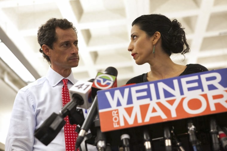 Anthony Weiner and his wife Huma Abedin attend a news conference in New York on Tuesday.