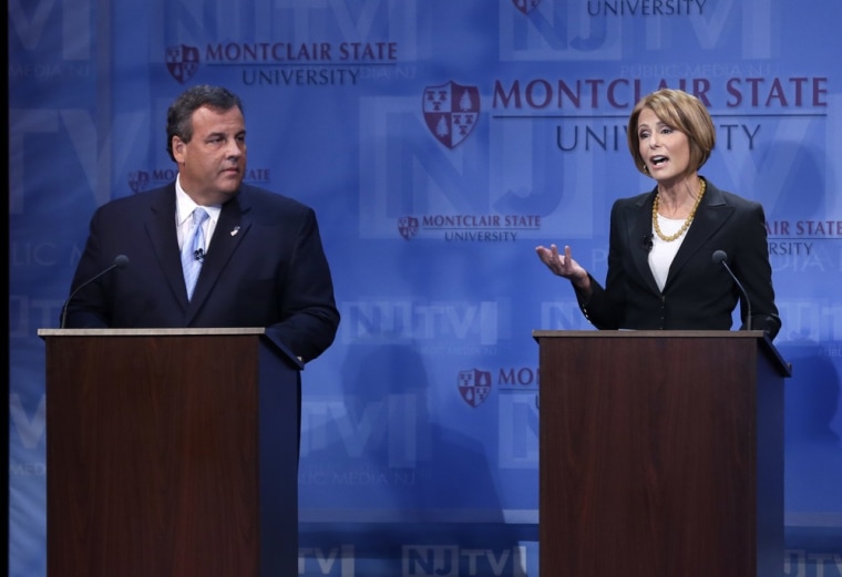 New Jersey Gov. Chris Christie, left, listens as Democratic challenger Barbara Buono answers a question during their debate at Montclair University on Tuesday.