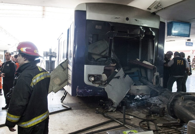 Firemen work at the site of a train accident at Once station in Buenos Aires, Argentina, on Oct. 19.