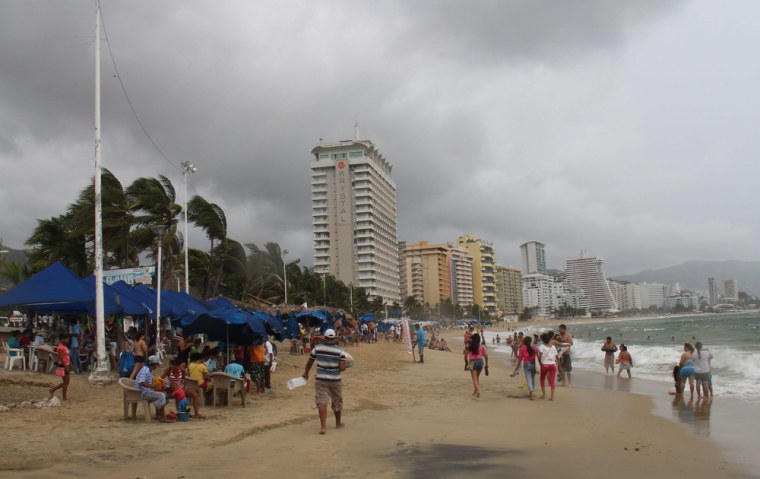 Clouds caused by the Hurricane Raymond hang over the beach in Acapulco, Mexico, on Oct. 20.