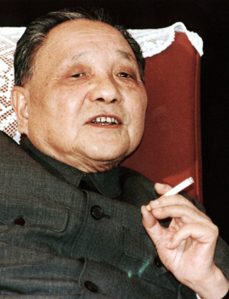 Smoking is deeply embedded in Chinese culture. China's leader Deng Xiaoping smokes one of his favorite Panda brand cigarettes in this 1986 file photo taken in Beijing.