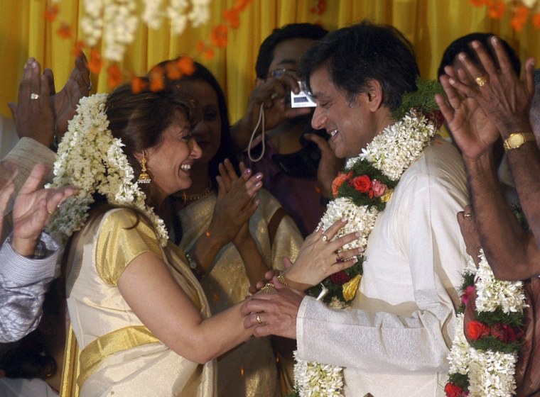 Sunanda Puskhar (L) and her husband Shashi Tharoor, India's Minister of State for Human Resource Development, share a moment during their wedding ceremony at Tharoor's house in Palakkad, in the southern Indian state of Kerala, August 22, 2010. Sunanda, 52, was found dead in a New Delhi hotel room on January 17, 2014, police said, days after she was involved in a row with a Pakistani woman journalist over Twitter. It was not immediately clear how Sunanda had died, Delhi police spokesman Rajan Bhagat said. Picture taken August 22, 2010. REUTERS/Stringer (INDIA - Tags: POLITICS CRIME LAW)