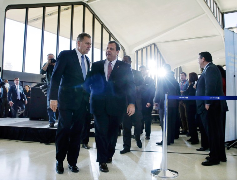 New Jersey Gov. Chris Christie walks with Port Authority Chairman David Samson at Newark Liberty International Airport, in Newark, N.J., Thursday, Nov. 14, 2013.