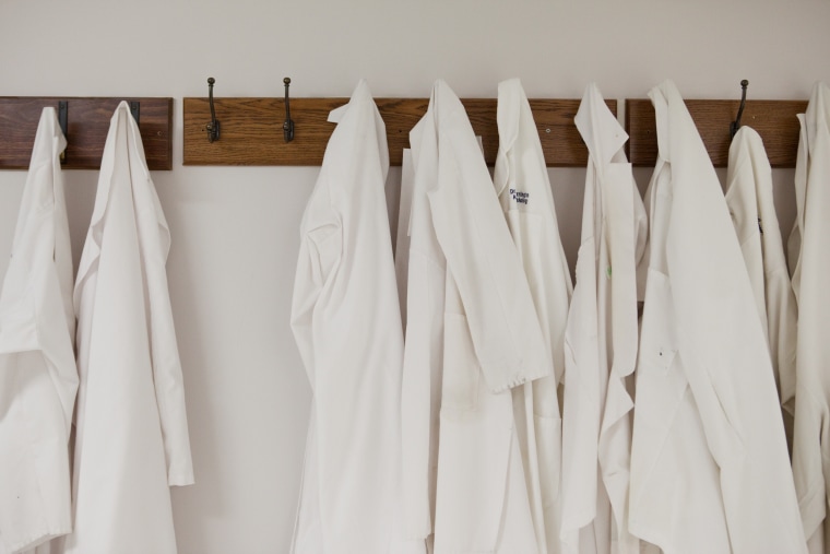 Lab coats hang outside the operating room at Washington Hospital Center on Friday, April 16, 2010 in Washington. (AP Photo/Evan Vucci)